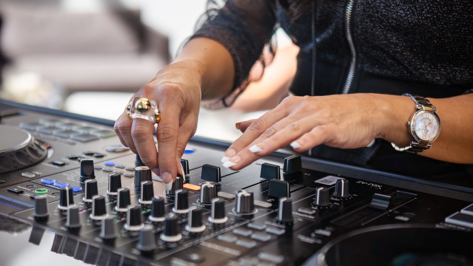 DJ adjusting controls at an event