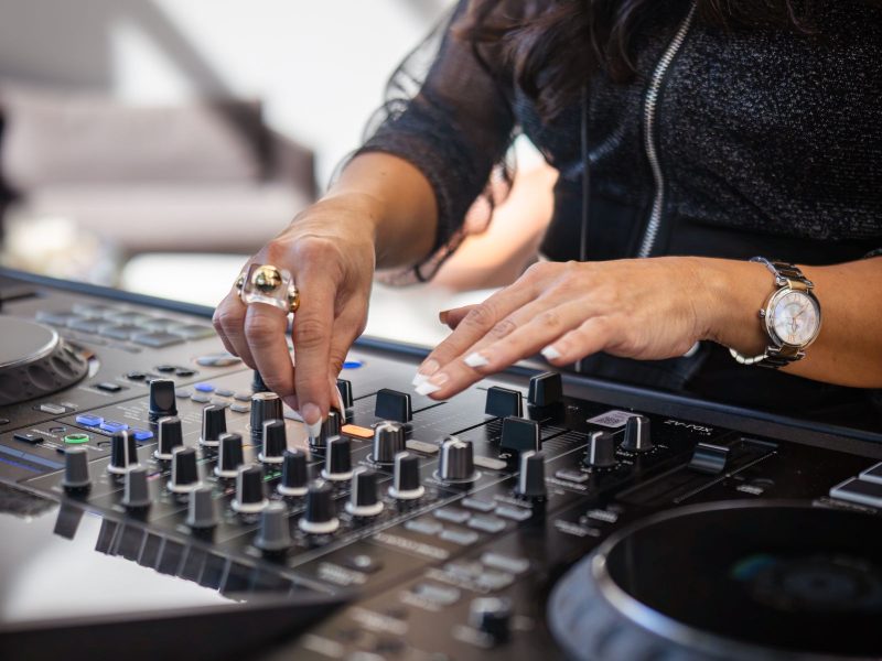 DJ adjusting controls at an event